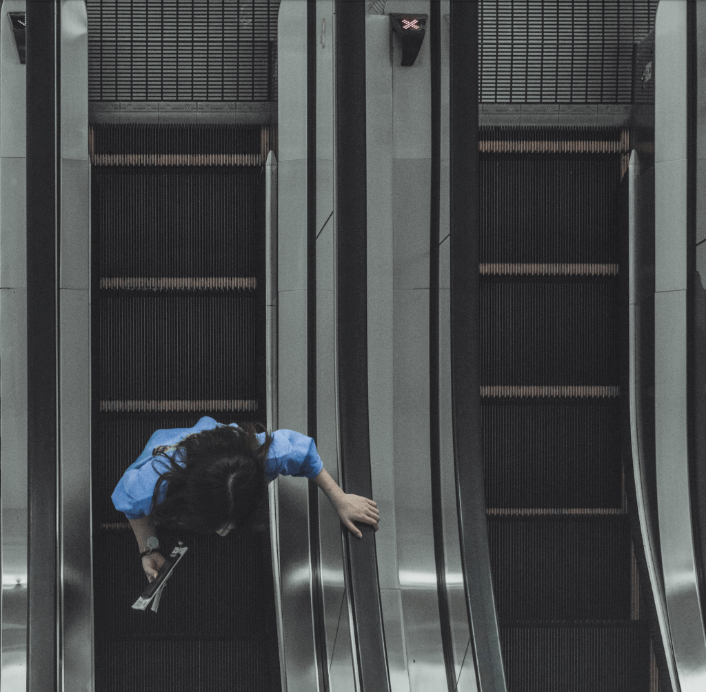 A photo of a passenger on an escaator